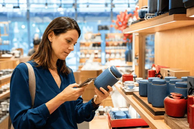 Traveler checking product quality and materials before buying a Chinese-made item