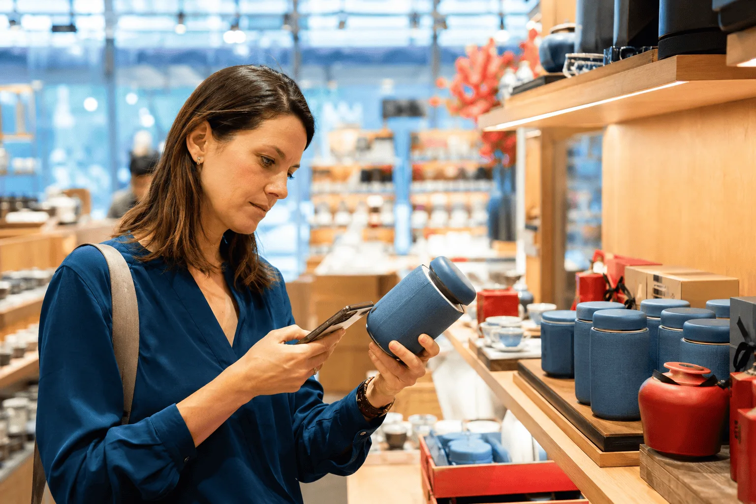 Traveler checking product quality and materials before buying a Chinese-made item
